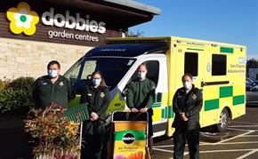 EEAST staff with array of plants thanks to generous donation from Dobbies