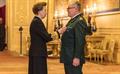 Paul Henry receives his Queen's Ambulance Service Medal from HRH Princes Anne