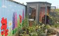 Wall mural and garden shed at Longwater Wellbeing Garden