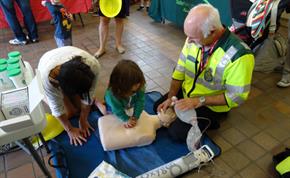 CFR doing CPR training with parent and child